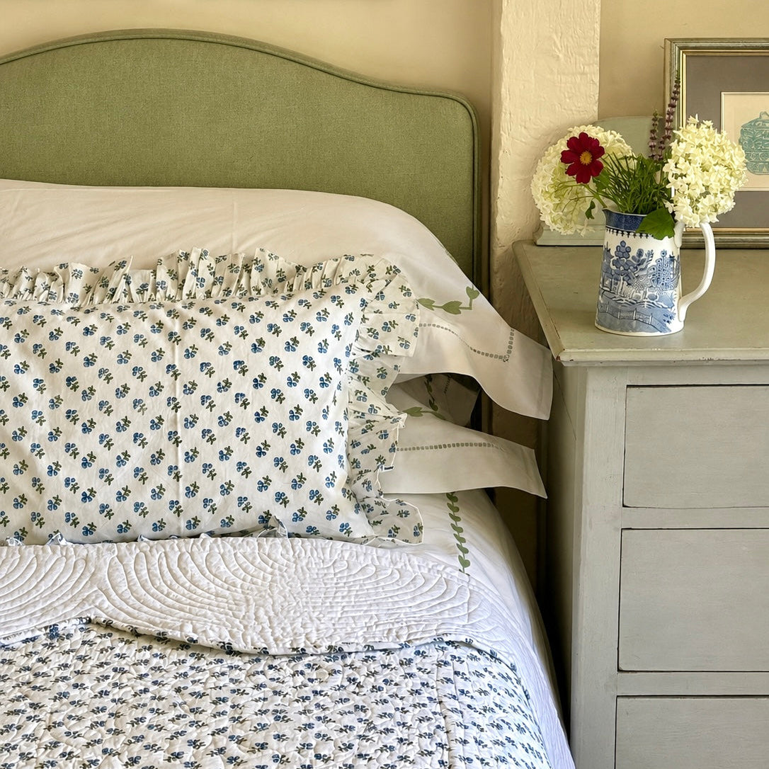 Blue and White block printed floral bedspread with scalloped edge
