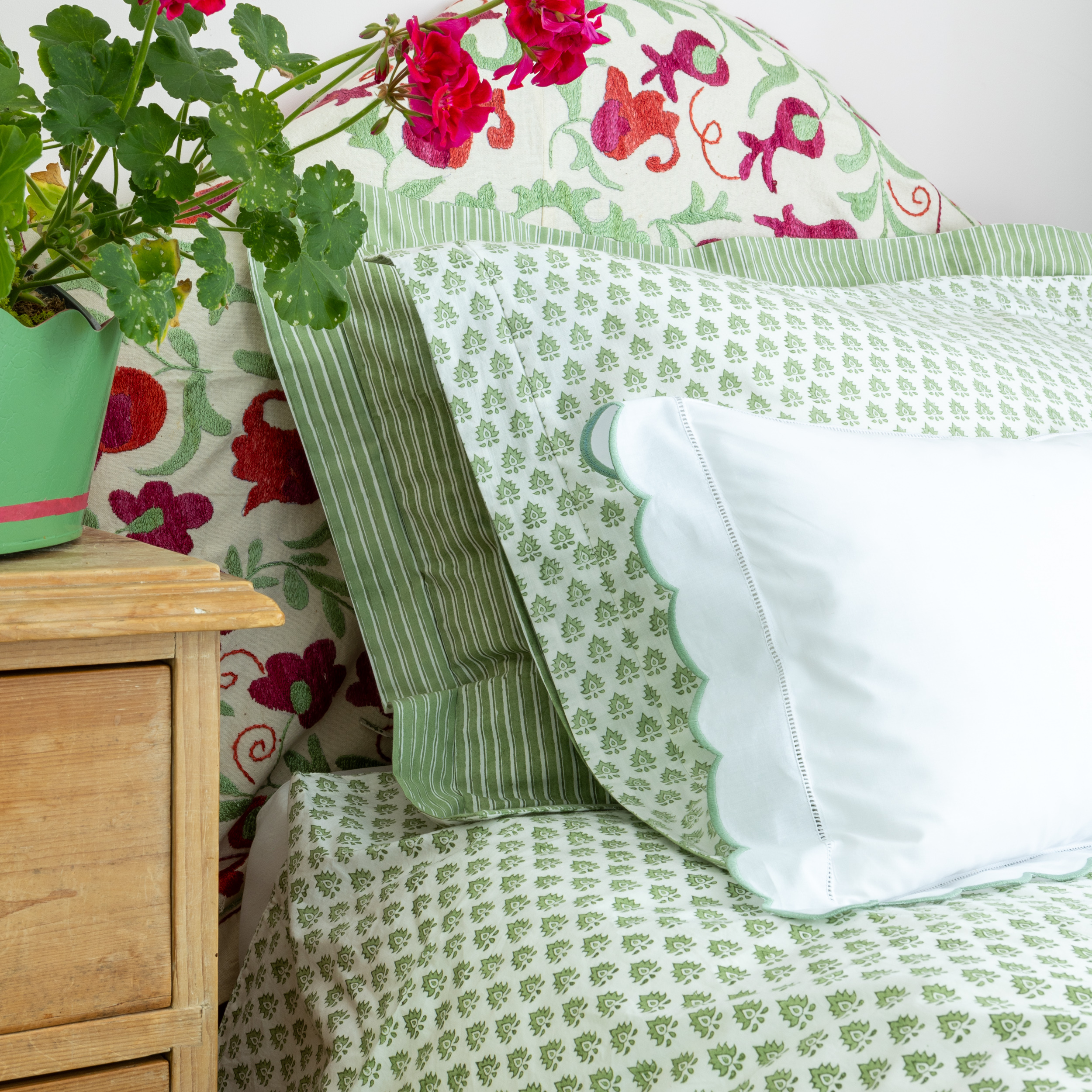Green hand block printed cotton duvet cover in our popular Pomily design on one side and classic stripes on the reverse.