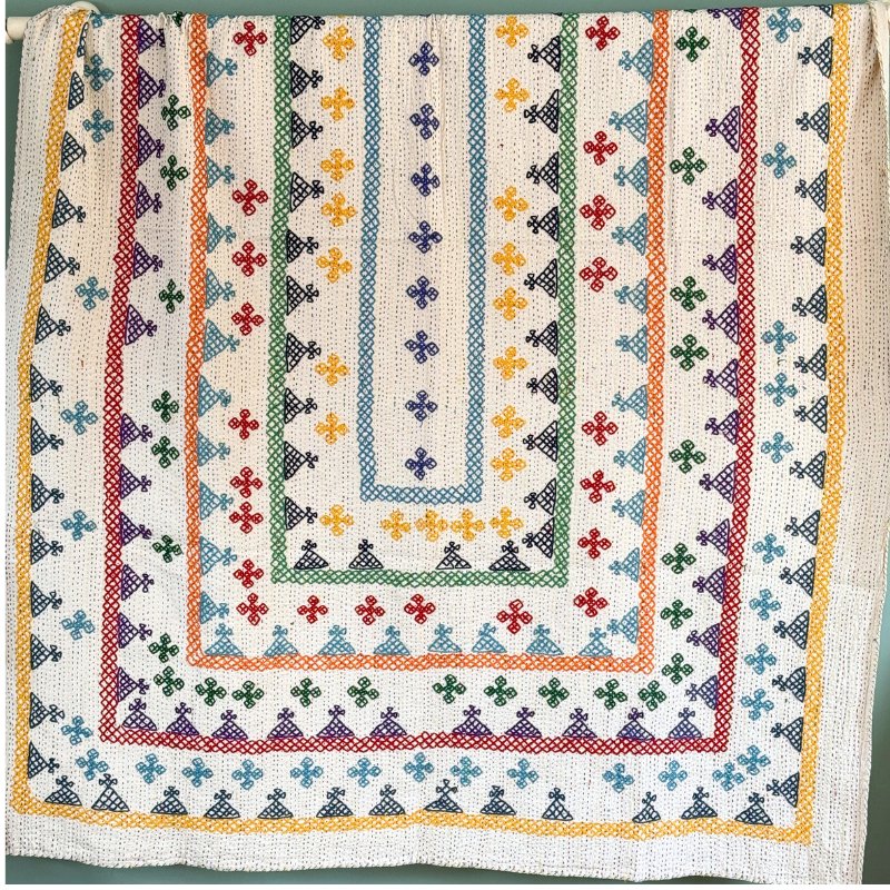 A unique lightweight kantha bedspread with beautiful coloured hand embroidery.