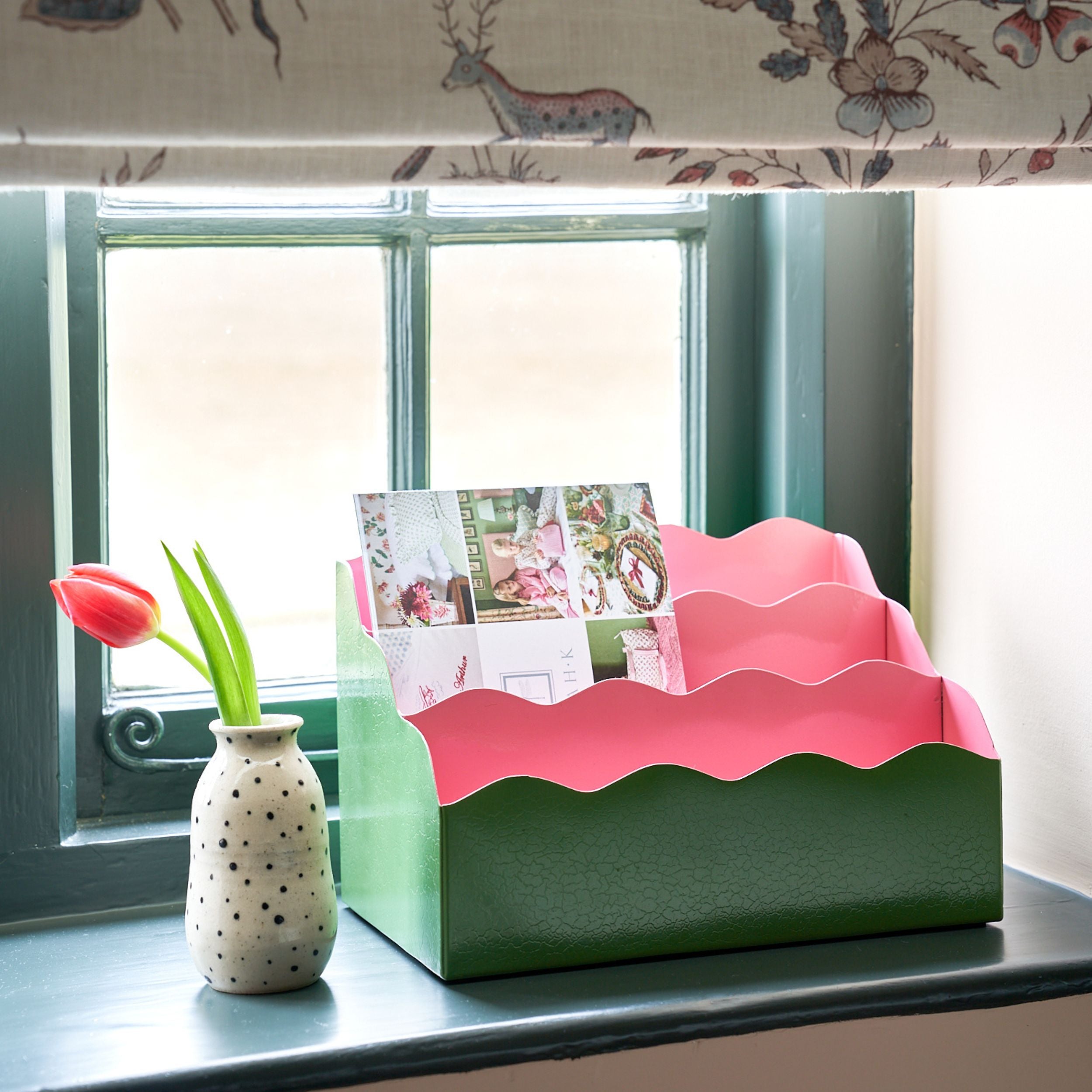green and pink letter holder