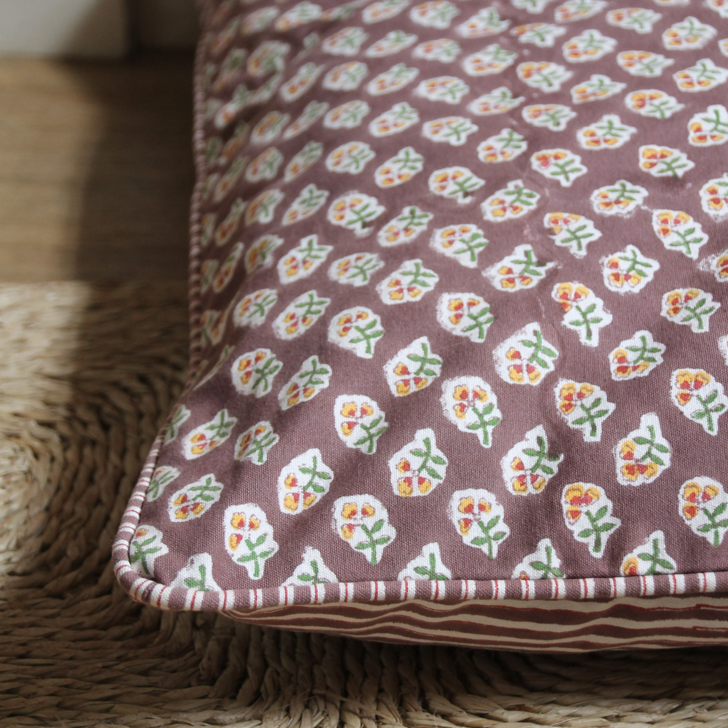 Floral-patterned fabric on a woven surface