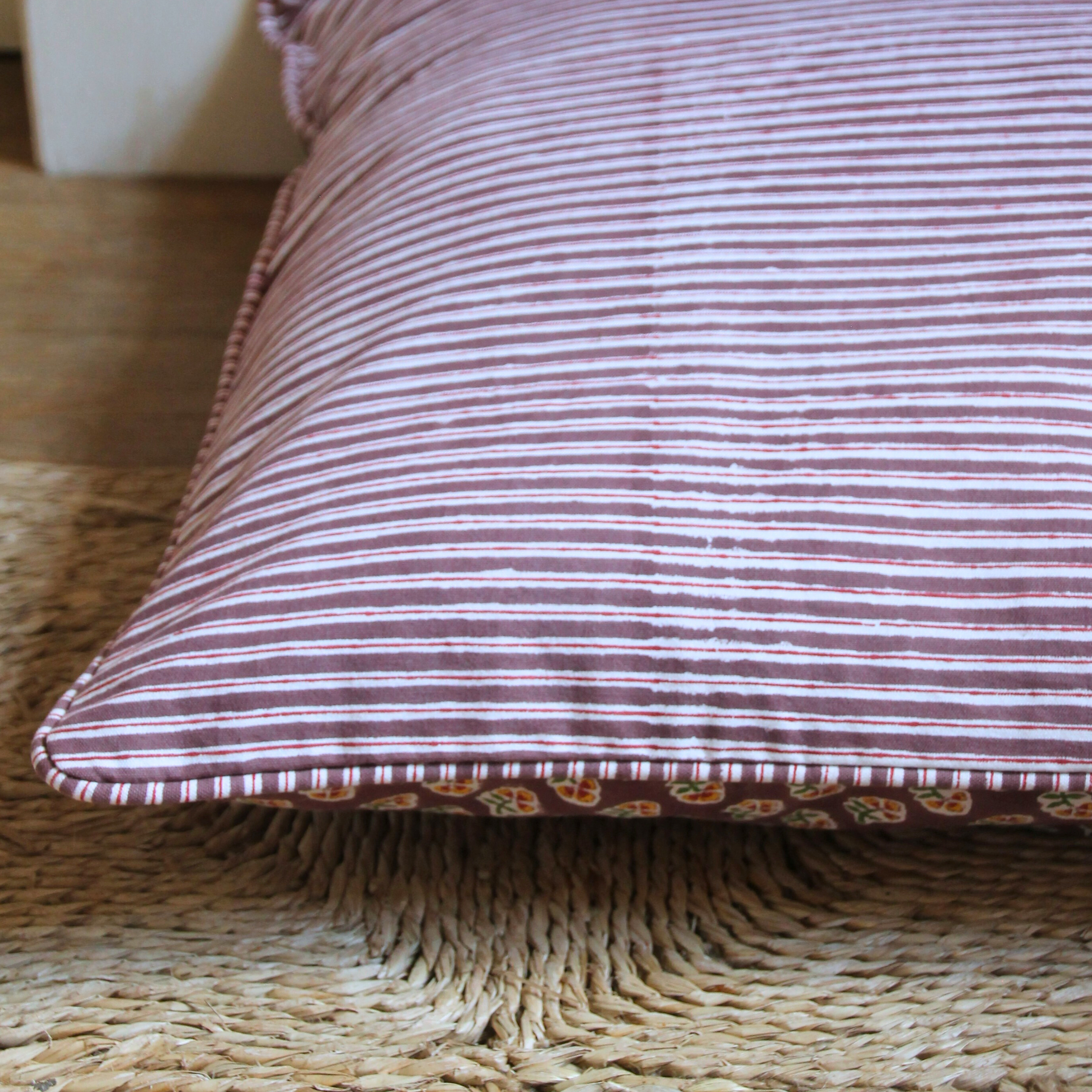 Striped pillow on a textured surface