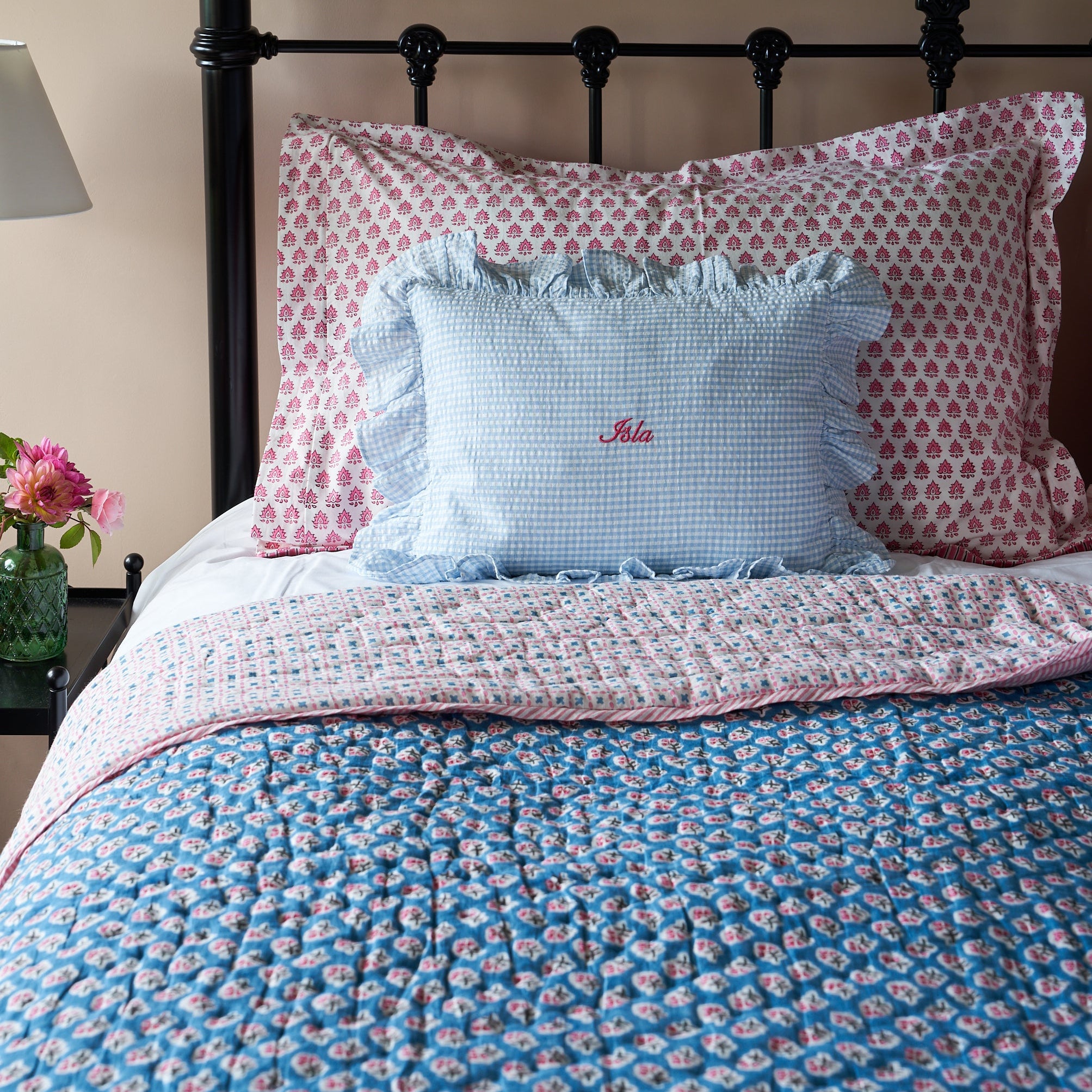 teal and pink floral blockprinted quilt