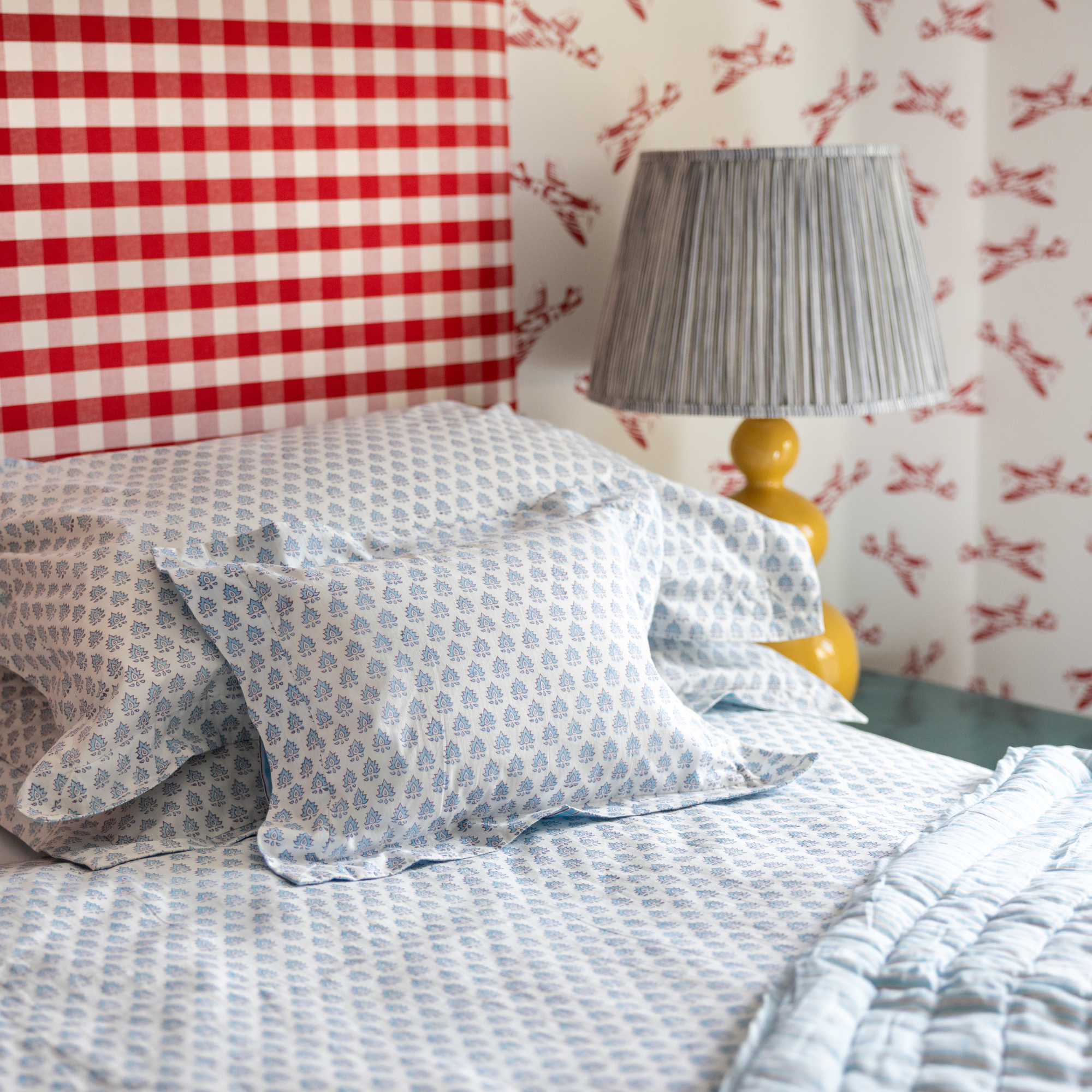 Hand block printed cotton duvet cover in Pomily design on one side and classic stripes on the reverse.