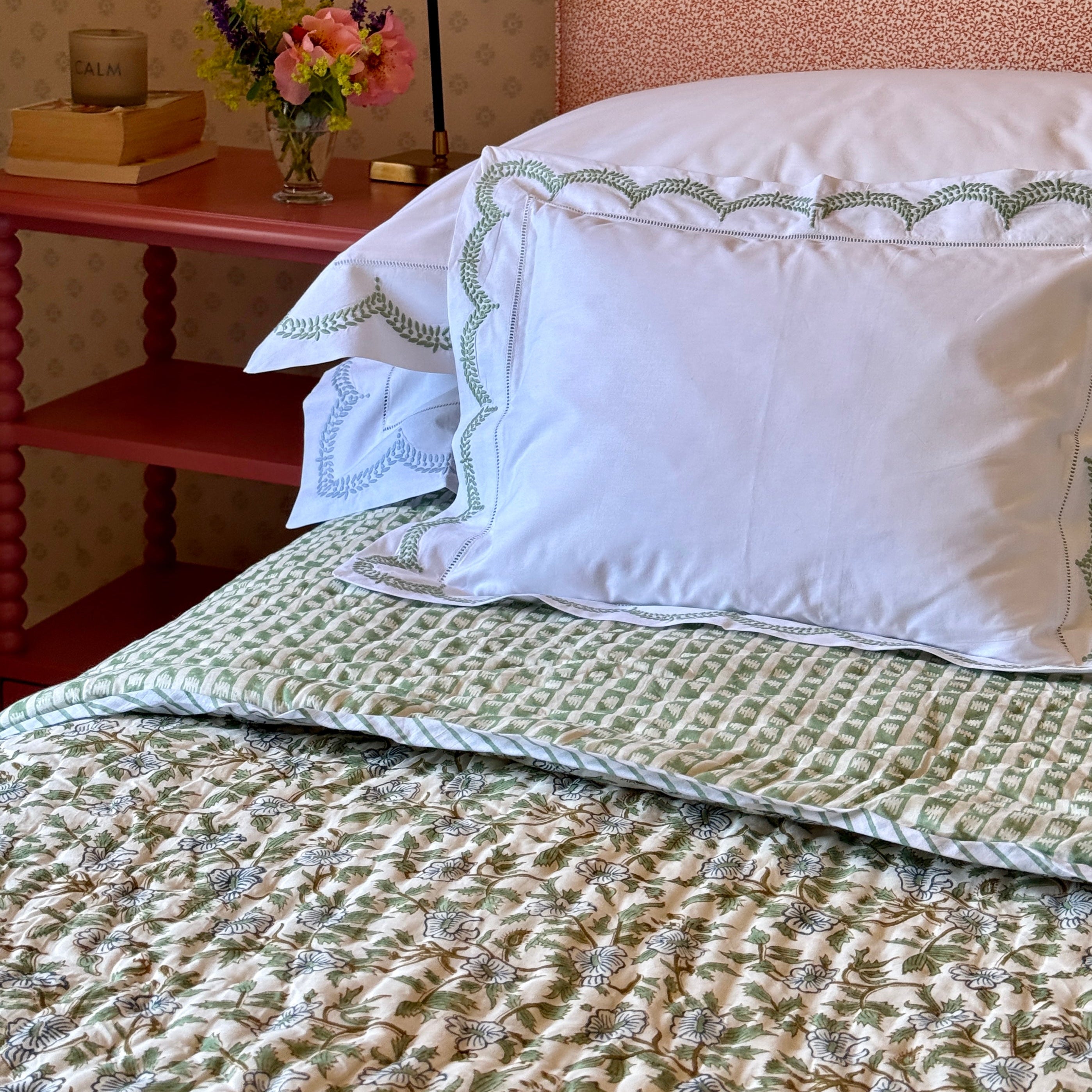 blue and green floral quilt