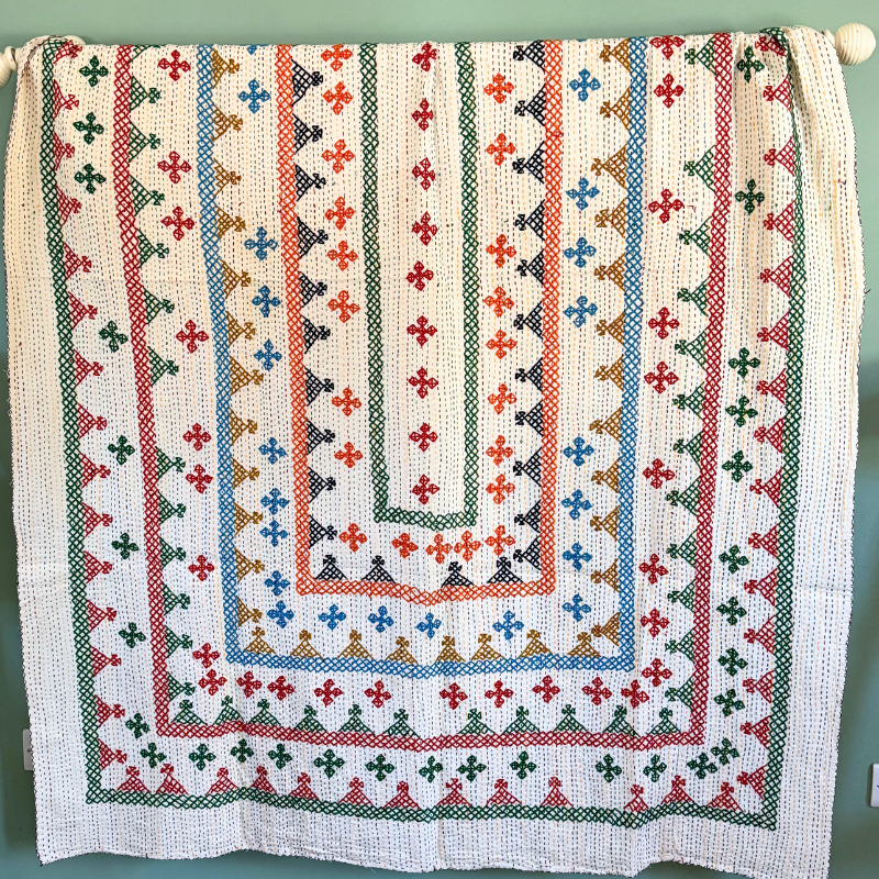 A unique lightweight kantha bedspread with beautiful coloured hand embroidery. 