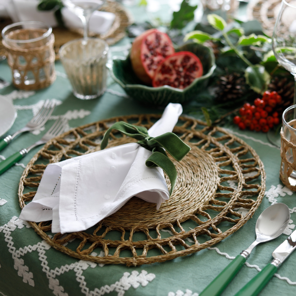Elegant cotton napkins hand embroidered with a border of white dots.